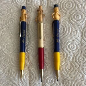 Blue and Yellow Pens with Gold Accents.